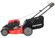 Side view photo of Craftsman lawn mower CM12AVB2C2093 with red deck, black engine, and rear grass bag on white background.
