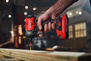 Photo of Craftsman cordless impact driver CMCF813B driving a screw into wood, close-up view.