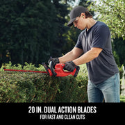 Photo of a person using a Craftsman cordless hedge trimmer CMCHT810B to trim bushes outdoors, showing dual action blades.