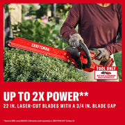 Photo of Craftsman hedge trimmer CMCHT830B cutting bushes, visible red body and 22 in. laser-cut blade.