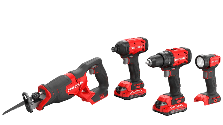 A set of four cordless Craftsman power tools, including a reciprocating saw, an impact driver, a drill, and a flashlight, all with red and black handles and rechargeable batteries attached.