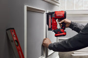 Photo of Craftsman cordless brad nailer CMCN623B in use installing decorative wall trim indoors.