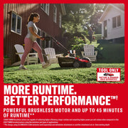 Photo of Craftsman lawn mower CMCOE210B in use on grass, side view, with person pushing mower in a backyard setting.