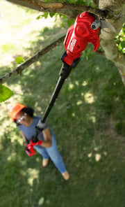 Photo of Craftsman pole pruner CMCPPR320B trimming a tree branch outdoors.