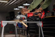 Photo of Craftsman cordless circular saw CMCS405B cutting wood in workshop, close-up of tool in use.