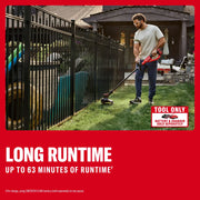 Photo of Craftsman cordless string trimmer CMCST901B used along fence, red tool, outdoor scene.