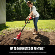 Photo of CRAFTSMAN cordless garden cultivator CMCTL320B in use on soil outdoors.