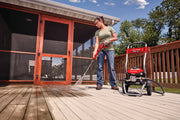 Photo of Craftsman CMEPW2100 pressure washer cleaning a wooden deck outdoors.