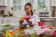 Photo of CRAFTSMAN CMGL100B glue gun used for floral crafts in a bright kitchen setting.