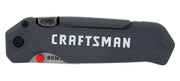 Photo of Craftsman folding utility knife CMHT10354, black and silver, side angle on white background.