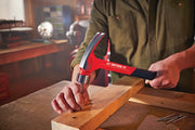 Photo of Craftsman claw hammer CMHT51435 in use, driving a nail into wood, red handle visible.