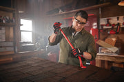 Photo of CRAFTSMAN CMHT82502 red pry bar in use on roofing shingles in a workshop setting.