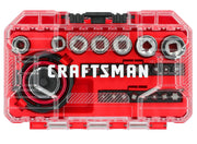 A clear plastic case with red interior containing a Craftsman socket and bit set. The set includes sockets, bits, and a ratchet with the Craftsman logo prominently displayed inside.
