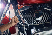 Photo of CRAFTSMAN wrench, SKU CMMT87023, being used on a motorcycle engine, close angle.