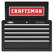 A black Craftsman tool chest with multiple drawers and a top lid open, showing a large Craftsman logo inside. There is a USA sticker and a Craftsman badge on the front.