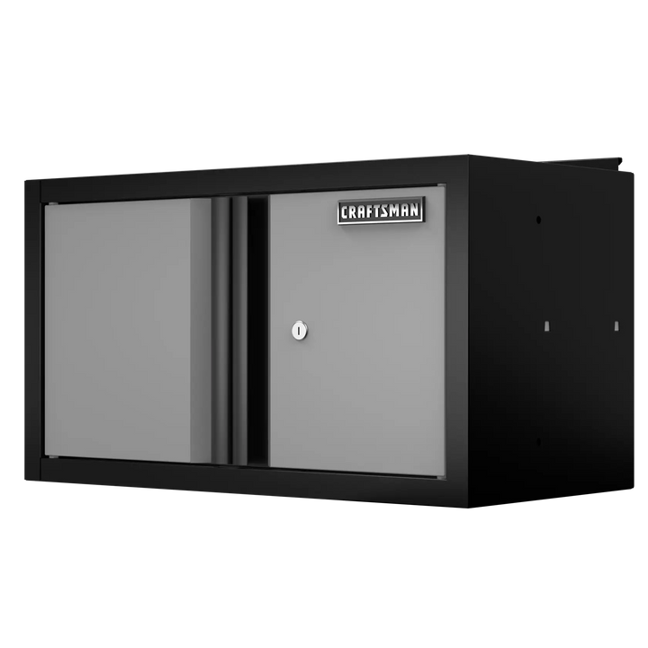 A metal wall-mounted storage cabinet with two doors, a lock, and a Craftsman brand label on the front.