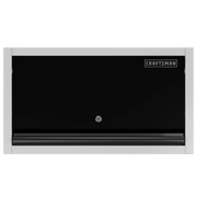 A front view of a CRAFTSMAN wall-mounted storage cabinet with a black door and a silver frame. The cabinet features a lock on the center and the CRAFTSMAN logo in the top right corner.