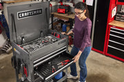 Photo of Craftsman tool chest CMST98276GB with open drawers filled with hand tools in a workshop setting.