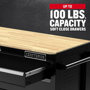 Photo of Craftsman black workbench with wood top and soft close drawers, SKU CMST98530BK, front angle.