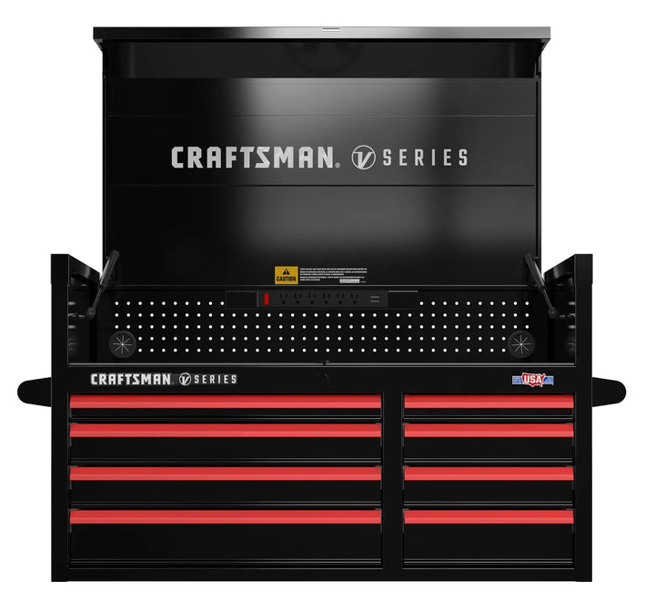 A black Craftsman V Series tool chest with an open top compartment and multiple red drawers. The chest features a pegboard section, a caution label, and a 'Made in USA' sticker on the front.