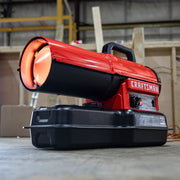Photo of Craftsman industrial heater CMXEHAO80FAK, red and black unit on warehouse floor, angled side view.