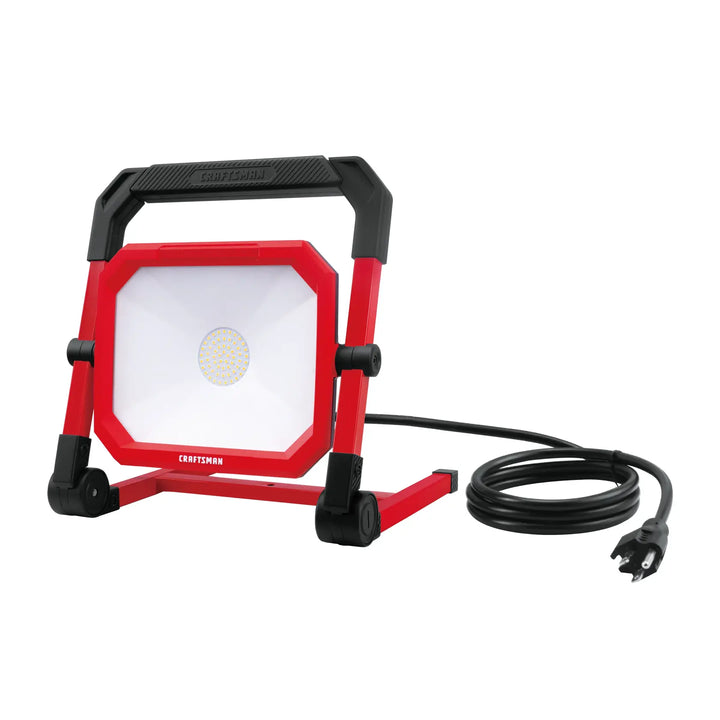 Photo of Craftsman LED work light with cord, red and black frame, front angle, CMXELAYMPL1028.