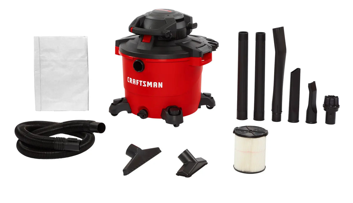 Photo of Craftsman wet/dry vacuum CMXEVBE17607 with red canister, black hose, filter, and multiple cleaning accessories, front angle.