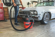 Photo of Craftsman wet/dry vacuum, SKU CMXEVBE17925, being used in a garage near a classic car.