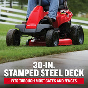 Photo of Craftsman riding lawn mower CMXGRAM1130035, red mower with stamped steel deck on grass.