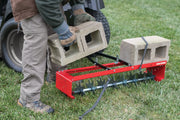 36 inch spike aerator load being placed on it.
