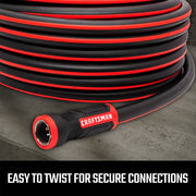 Craftsman garden hose CMXMHBB16515, black with red accents, coiled on concrete, close-up of connector.