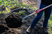 Photo of CRAFTSMAN CMXMLTP35326 garden shovel with wooden handle moving soil outdoors.