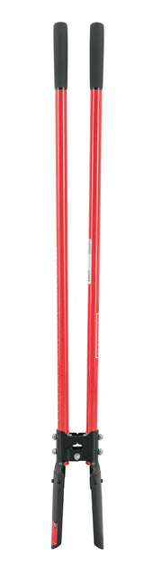 A post hole digger with two long red handles and black grips, designed for digging narrow holes for fence posts or similar purposes. The blades are black and joined at the base.