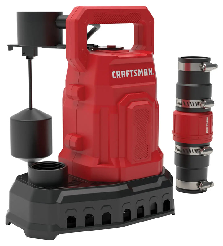 A red and black Craftsman sump pump with a float switch attachment on the left and a set of pipe connectors on the right. The pump features a sturdy handle on top and sits on a black base.