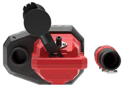 Close-up view of a professional photography accessory, featuring a red and black device with multiple components and connectors, shown from above on a white background.