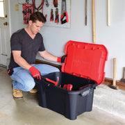 Photo of a person in gloves opening a Craftsman storage container CMXXPBP20GT in a garage with tools.