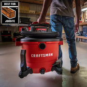 Photo of Craftsman wet/dry vacuum CMXZVBE37413, red body, hose attached, carried in workshop.
