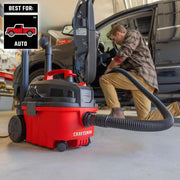 Photo of Craftsman wet/dry vacuum CMXZVBE38336 in a garage used for auto cleaning, red and black design.