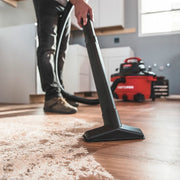 Photo of Craftsman wet/dry vacuum CMXZVBE38606 cleaning wood floor in a home setting.