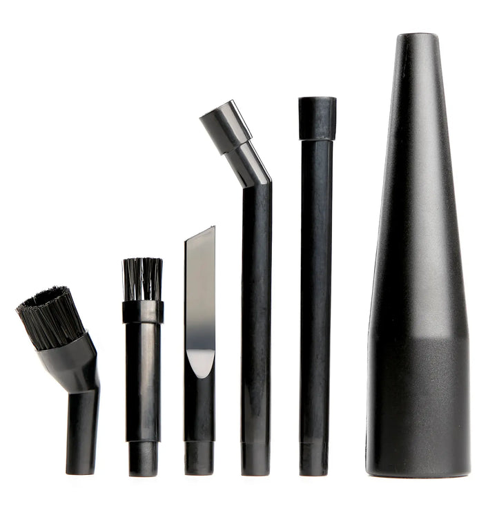 A set of six black vacuum cleaner attachment tools, including different nozzles and brushes, arranged upright in a row on a white background.
