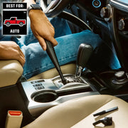 Photo of person using Craftsman auto cleaning tool CMXZVBE38668 to detail a car's center console and gear shift area.
