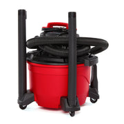 Photo of Craftsman wet/dry vacuum CMXZVBE38675, red body with black hose and accessories, front angle.
