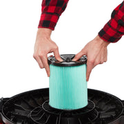 Photo of Craftsman replacement vacuum filter SKU CMXZVBE38753 being installed in a black vacuum base, front angle.