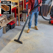 Craftsman CMXZVBE38755 graphics showing jobsite vacuum cleaning wood sawdust from workshop floor.