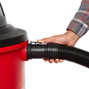 Photo of Craftsman CMXZVBE38759 vacuum hose being attached to red canister, close-up, white background.