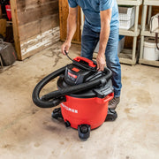 Photo of Craftsman wet/dry vacuum CMXZVBE38759 with red body and black hose in a workshop setting.