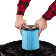 Photo of Craftsman CMXZVBE38776 pleated blue vacuum filter being installed, close-up angle.