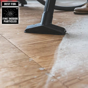 Craftsman vacuum nozzle cleaning fine indoor particles from floor, close-up view, CMXZVBE38776.