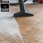 CRAFTSMAN CMXZVBE38777 vacuum nozzle cleaning fine indoor particles from wood flooring, close-up photo.