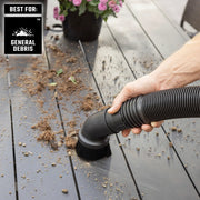 Photo of Craftsman brush vacuum nozzle CMXZVBE38779 cleaning debris from outdoor table surface.